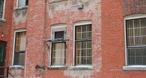 Res brick building with large windows.