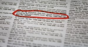 Close up newspaper with classified ad circled in marker.