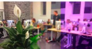 A pixelated image of students using computers