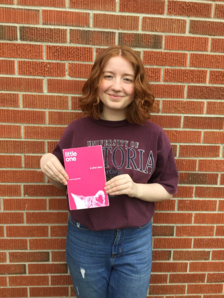 Ava, high school girl, holding a copy of the script for Hannah Moscovitch's Little One for her directing project.